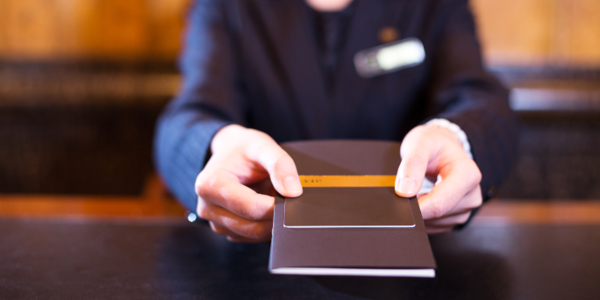 hand with credit card in luxury hotel