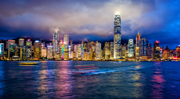 Hong Kong financial district at twilight, Victoria Harbour, Hong Kong Island.