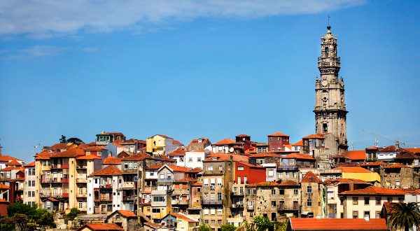 Clerigos church tower and Ribeira old town skyline (Porto, Portugal)