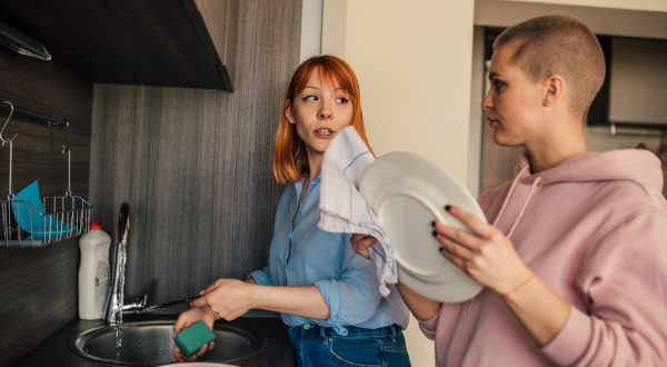 Young woman helping with the dishes